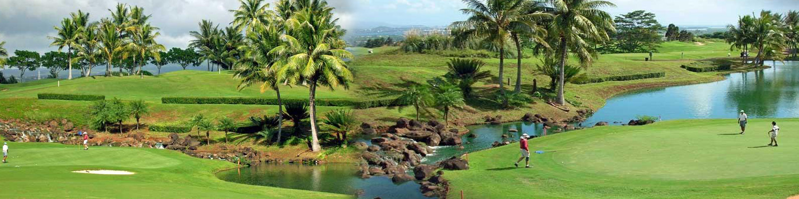Royal Kunia Country Club golf course on Oahu featuring rolling fairways, water hazards, and panoramic mountain views